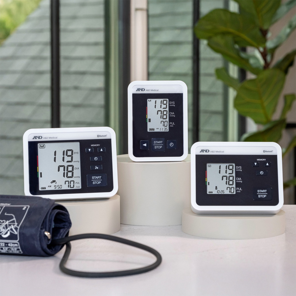 Three blood pressure monitors displayed together.